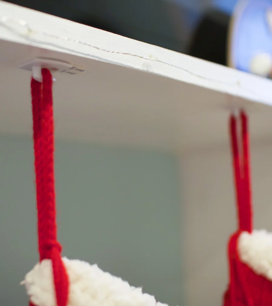 3M Command hooks save the day! They're small decorating clips are great for hanging stockings.