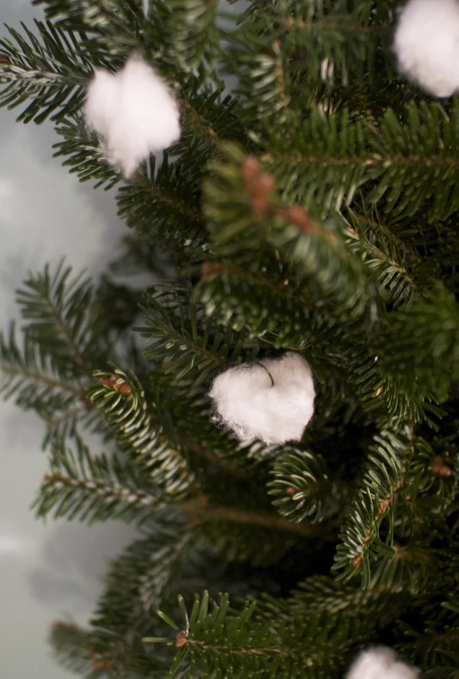 Cotton balls attached with floral wire give a whimsical touch to a basic wreath