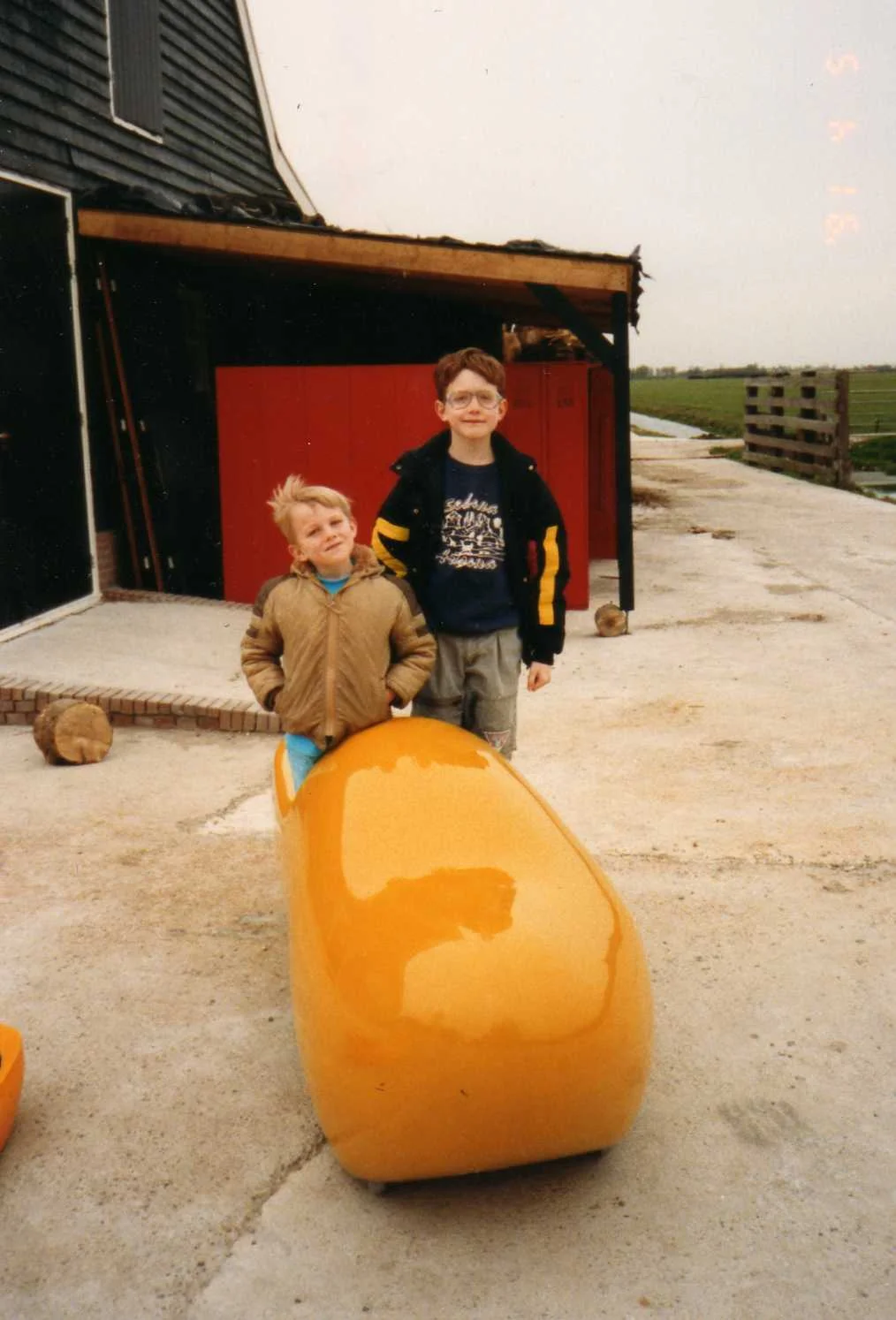 My brother and I in Holland, in a big ass clog, keeping out feet protected from bad...things.