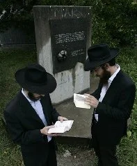 This is the Sept. 2007 file photo of Chabad Rabbi Motti Seligson, and Chabad Rabbi Saadya Notik, left, from New York visit the World War II Nazi concentration camp Sajmiste in Belgrade, Serbia