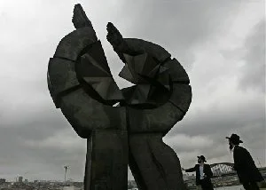 This is the Sept. 2007 file photo of Chabad Rabbi Motti Seligson, and Chabad Rabbi Saadya Notik, right, from New York look at a monument in the World War II Nazi concentration camp Sajmiste in Belgrade
