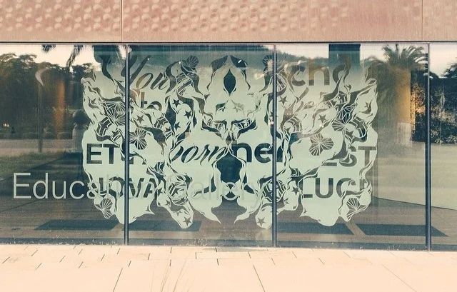 12' x 7' floating hand cut paper piece in the window of the de Young Museum's Kimball Gallery titled "Nove Lux". Ian Kuali'i