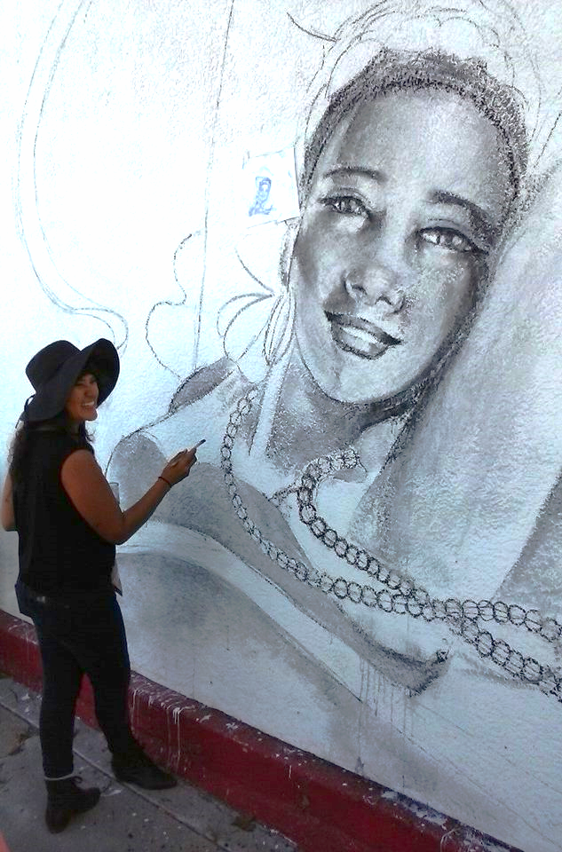 Nani Chacon sketches out a new mural in Bareles, NM.