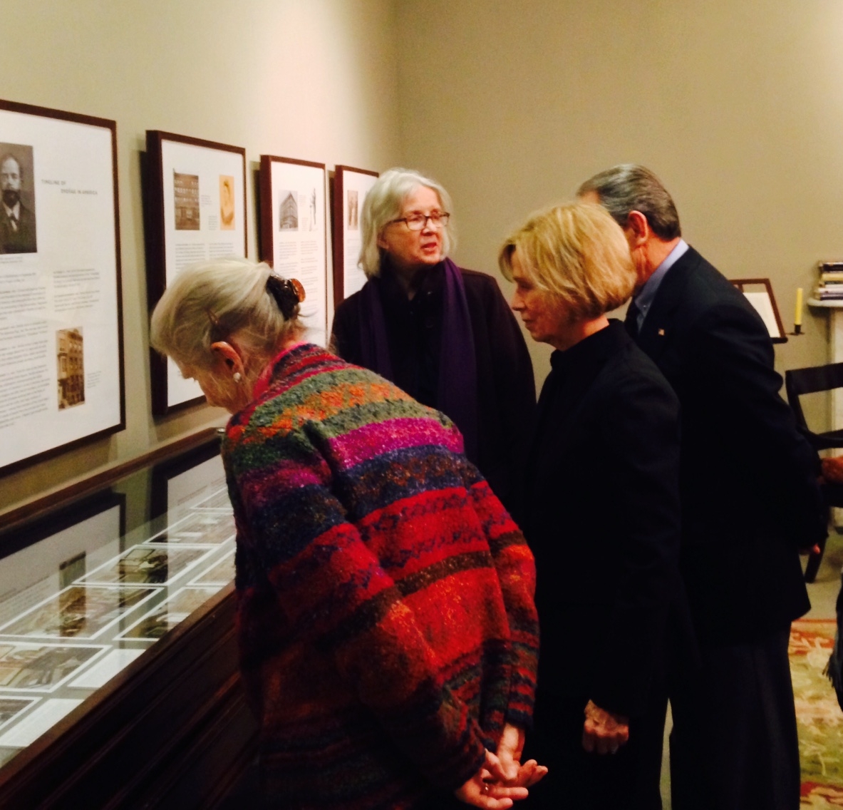 Guests tour the "Mythic Bohemia" exhibit in the Dvořák Room with Majda Kallab Whitaker.
