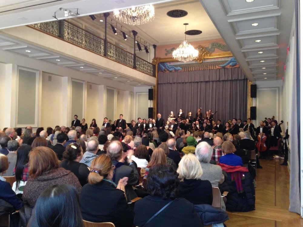 Maestro Maurice Peress and the Orchestra of the Aaron Copland School of Music perform before a full house in the historic ballroom of the Bohemian National Hall.  Photo Credit: DAHA