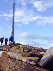 Monica's rock (with a smile!) after traveling / walking / rolling 584.8km from Saint Jean Pied de Port (France) to Cruz de Ferro (Spain) on the Saint James Way! AmAzing!