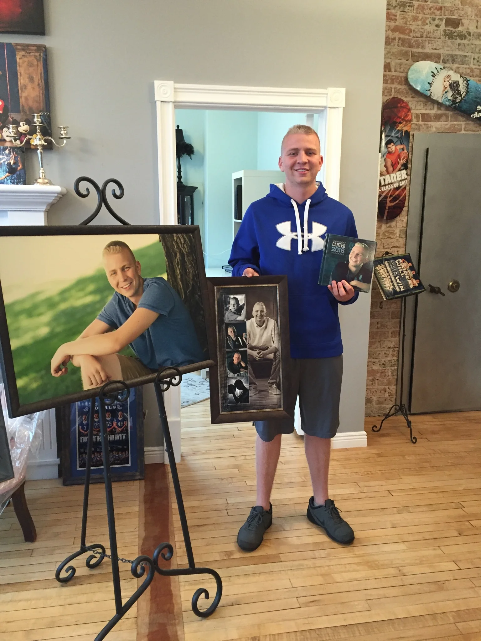 SCC Senior, Carter, with his wall portraits and album!