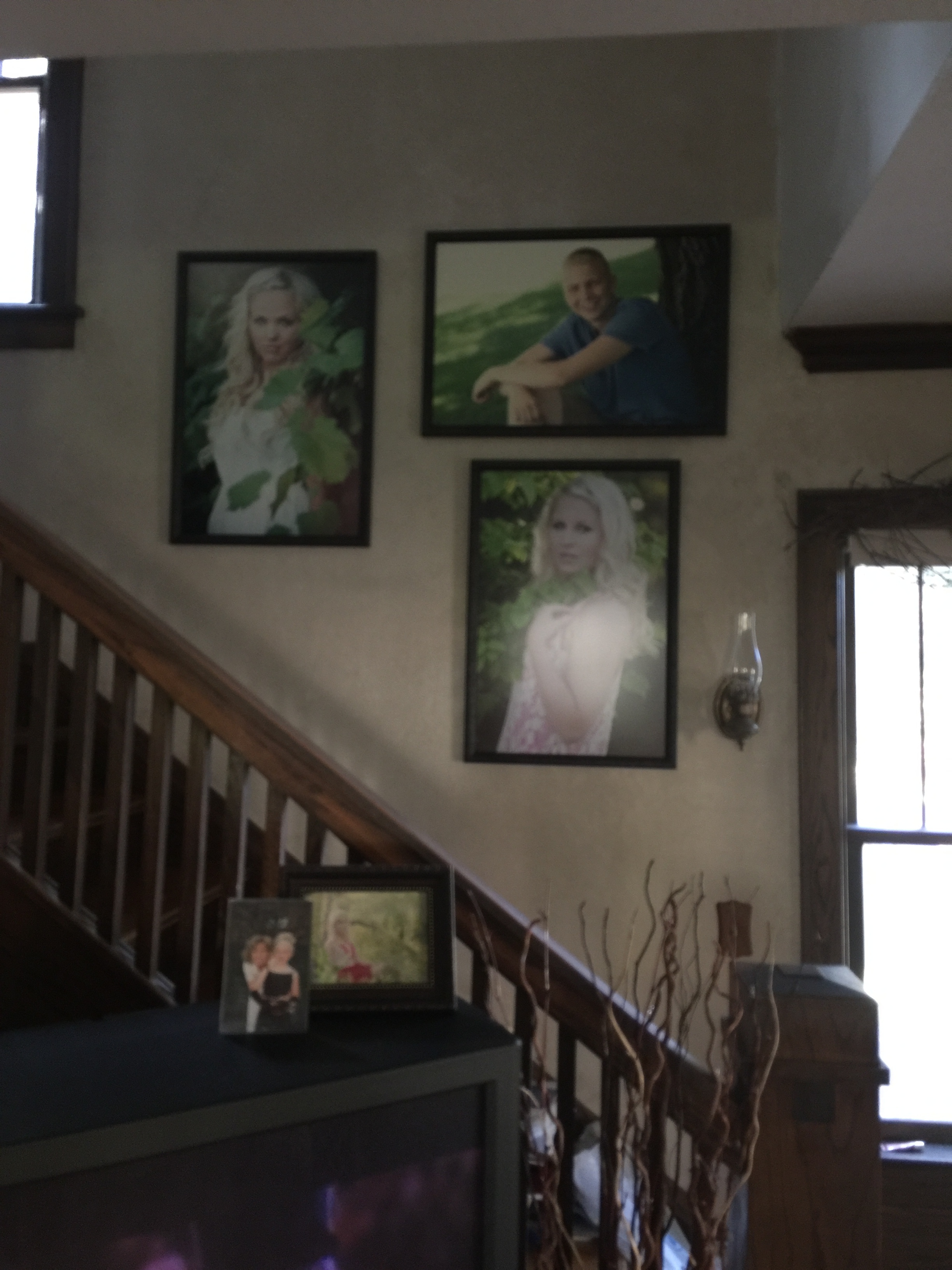 Carter's wall image hanging in his home next to his sisters's images!