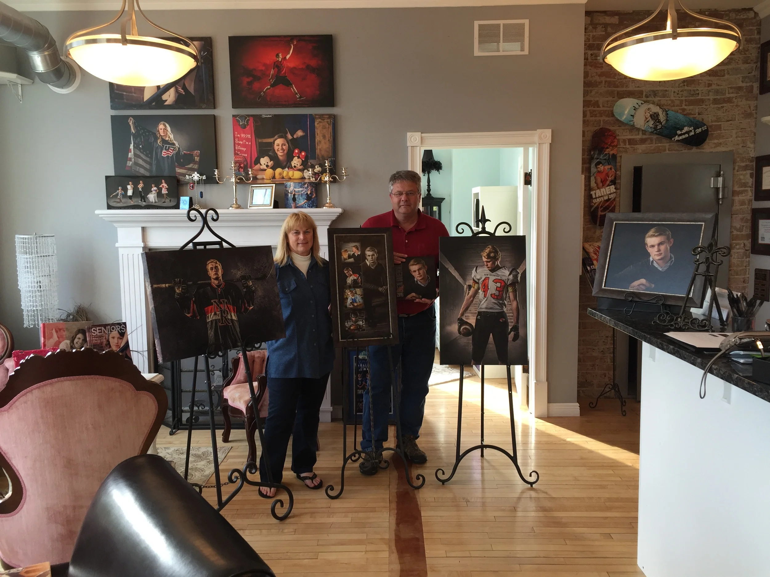 The Werner Family with their son, Ben's wall art collection and Senior album.