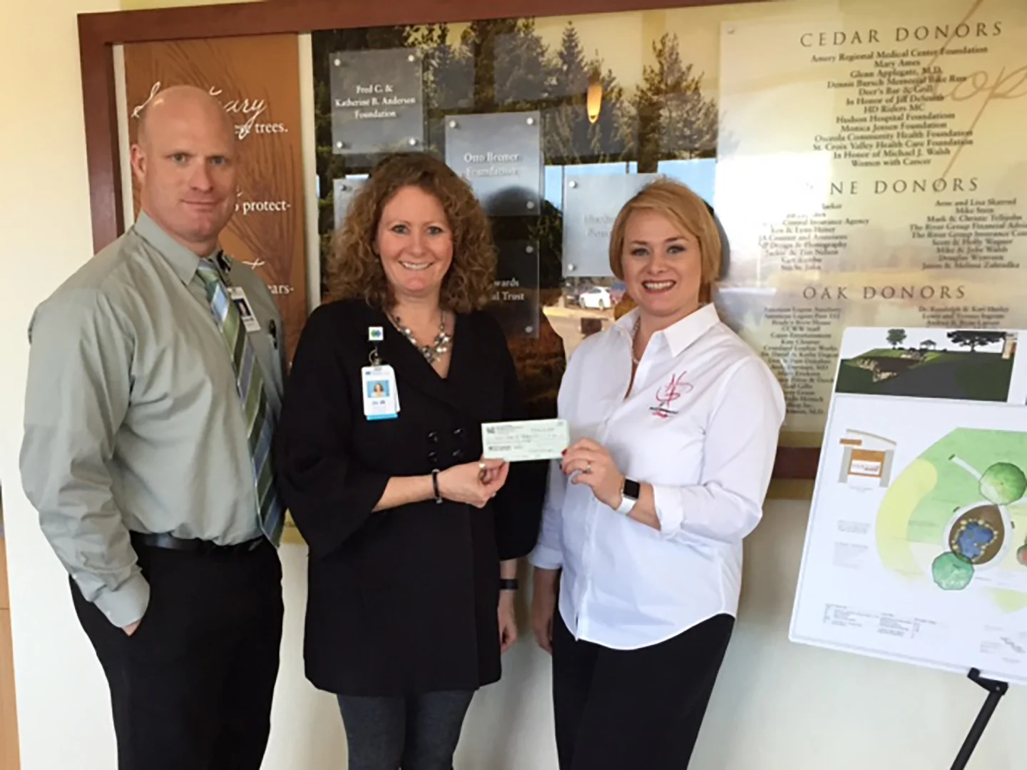 Teresa donating our check to the Westfields' crew, Steve Massey and Jo Wrich.