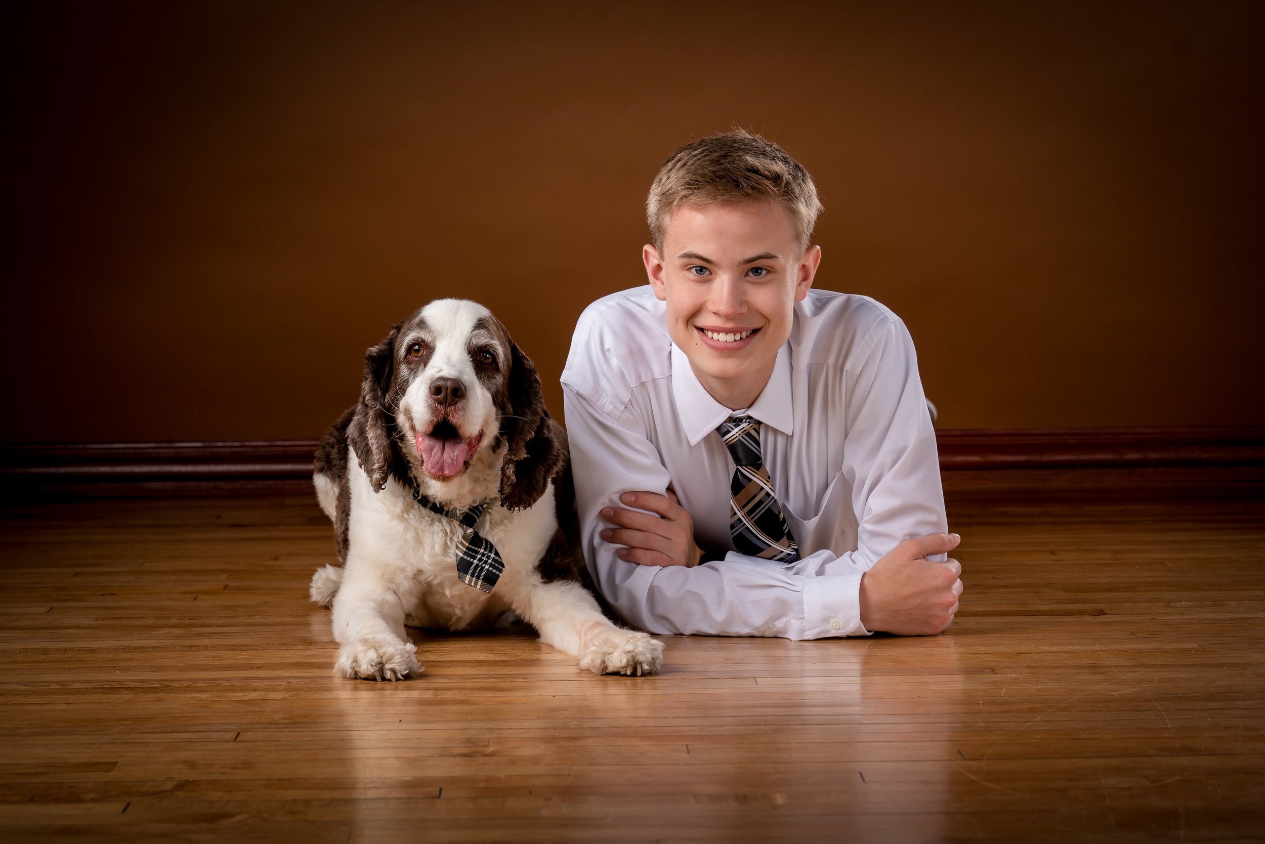 Senior boy with dog matching ties