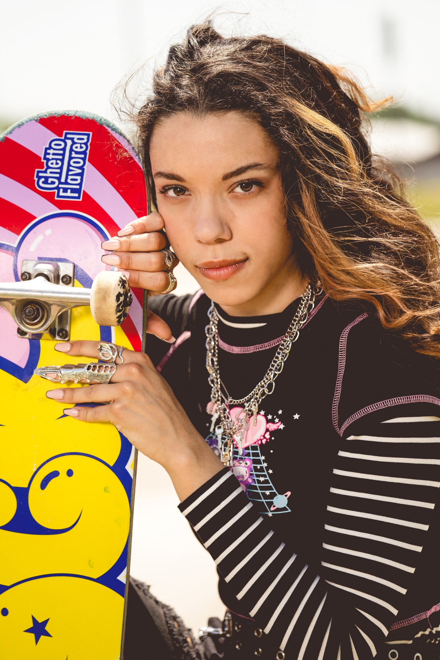 skater girl close-up posing with skateboard