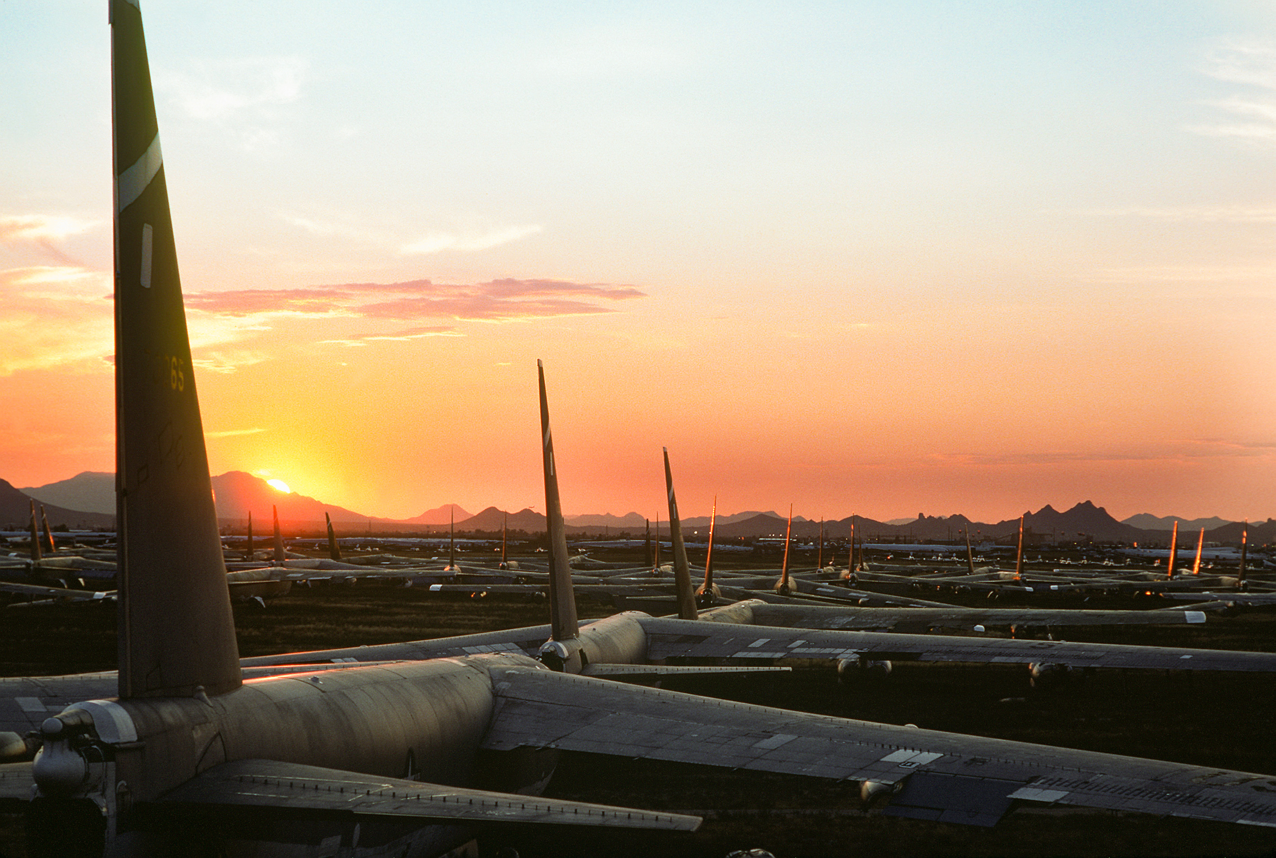 Dozens_of_B-52_Stratofortress_aircraft_are_bathed_in_the_glow_of_the_setting_sun_as_they_sit_on_the_desert_floor_at_the_Aerospace_Maintenance_and_Regeneration_Center_DF-ST-89-10582.jpg