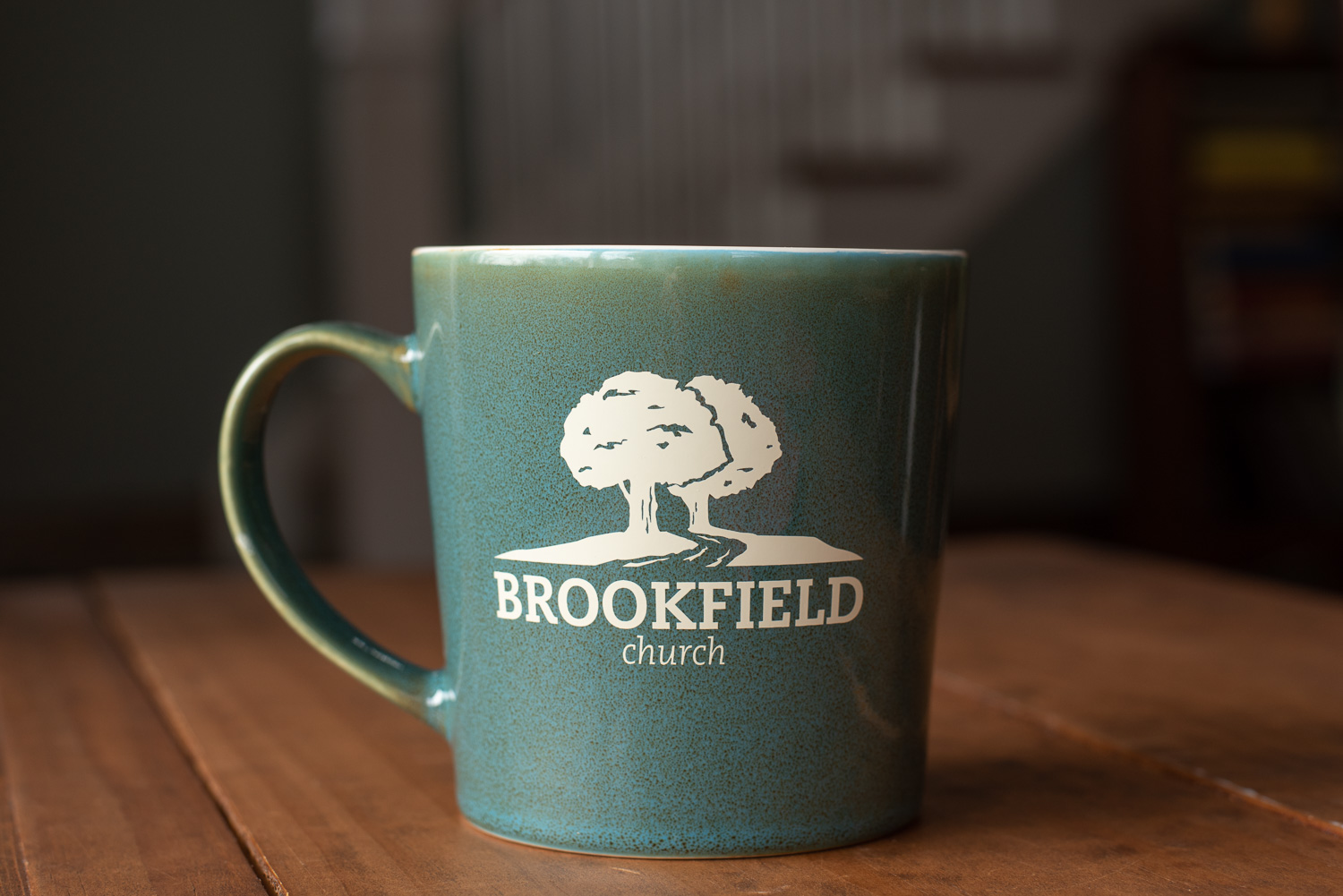 A coffee mug with an alternative logo for Brookfield Church in Athens, Ohio.