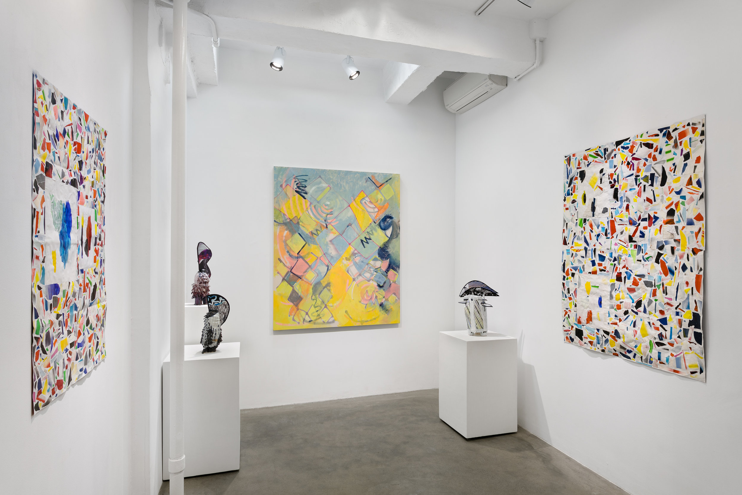 Installation view with works on paper by Josh Slater, painting by Lauren Portada, and sculptures by Leah Tacha