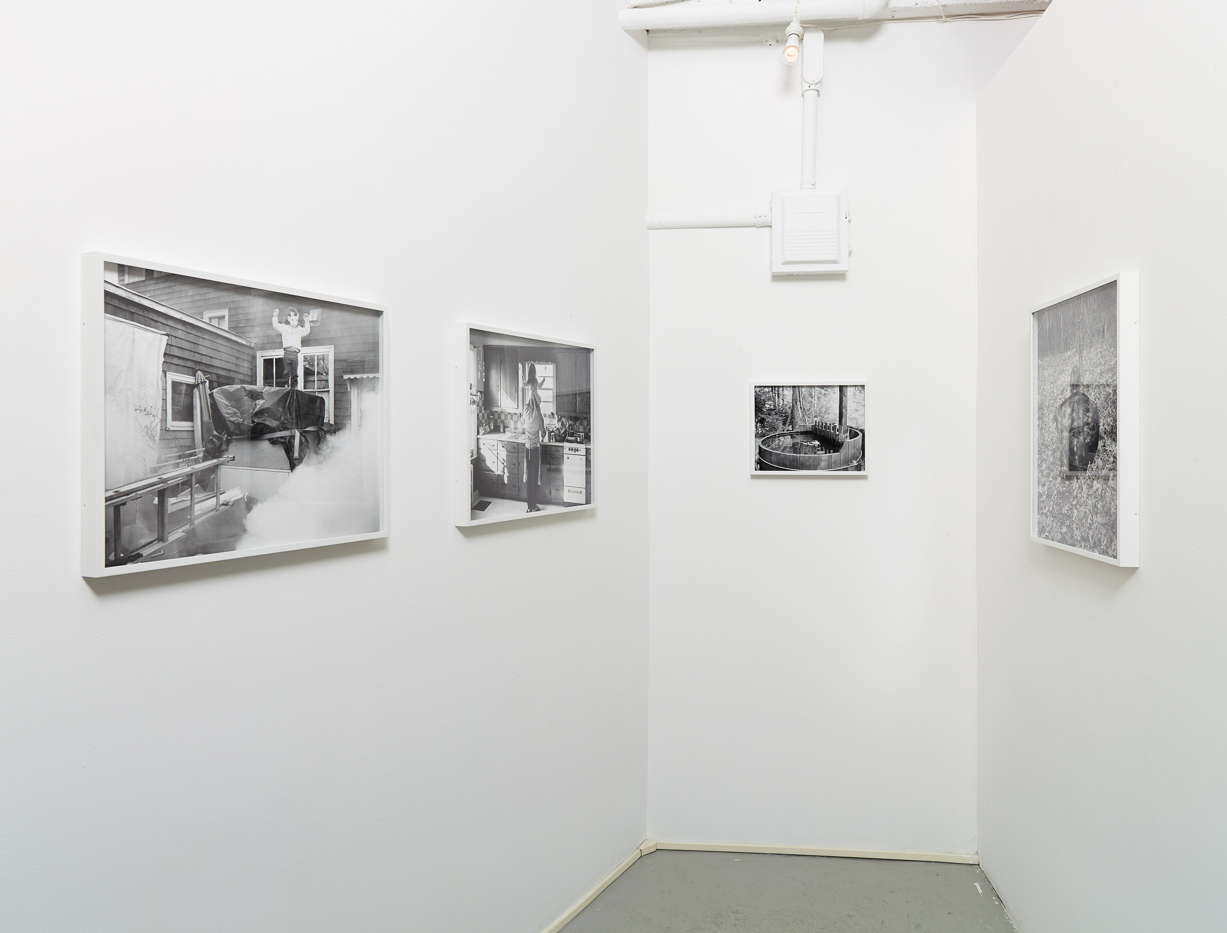 Installation view of black and white photographs by Scott Alario in his solo exhibition ' What We Conjure'