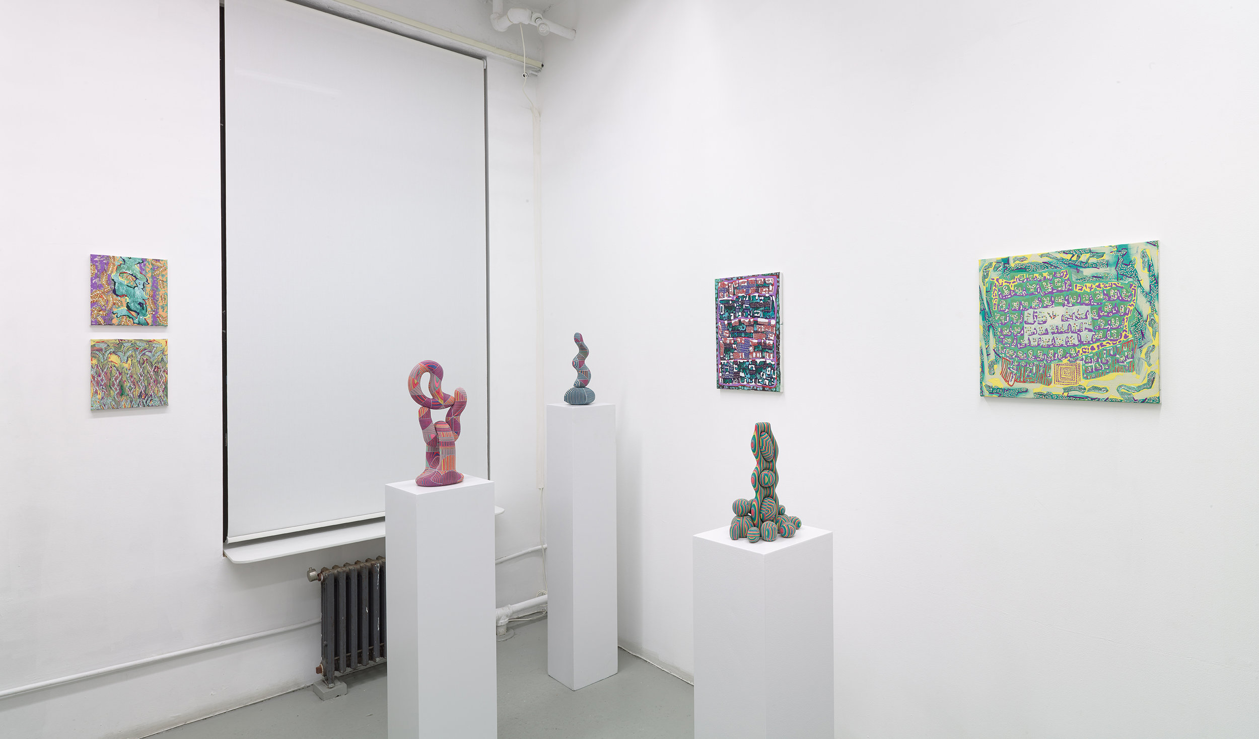 Installation view displaying sculptures by Bayne Peterson and paintings by Nadia Haji Omar