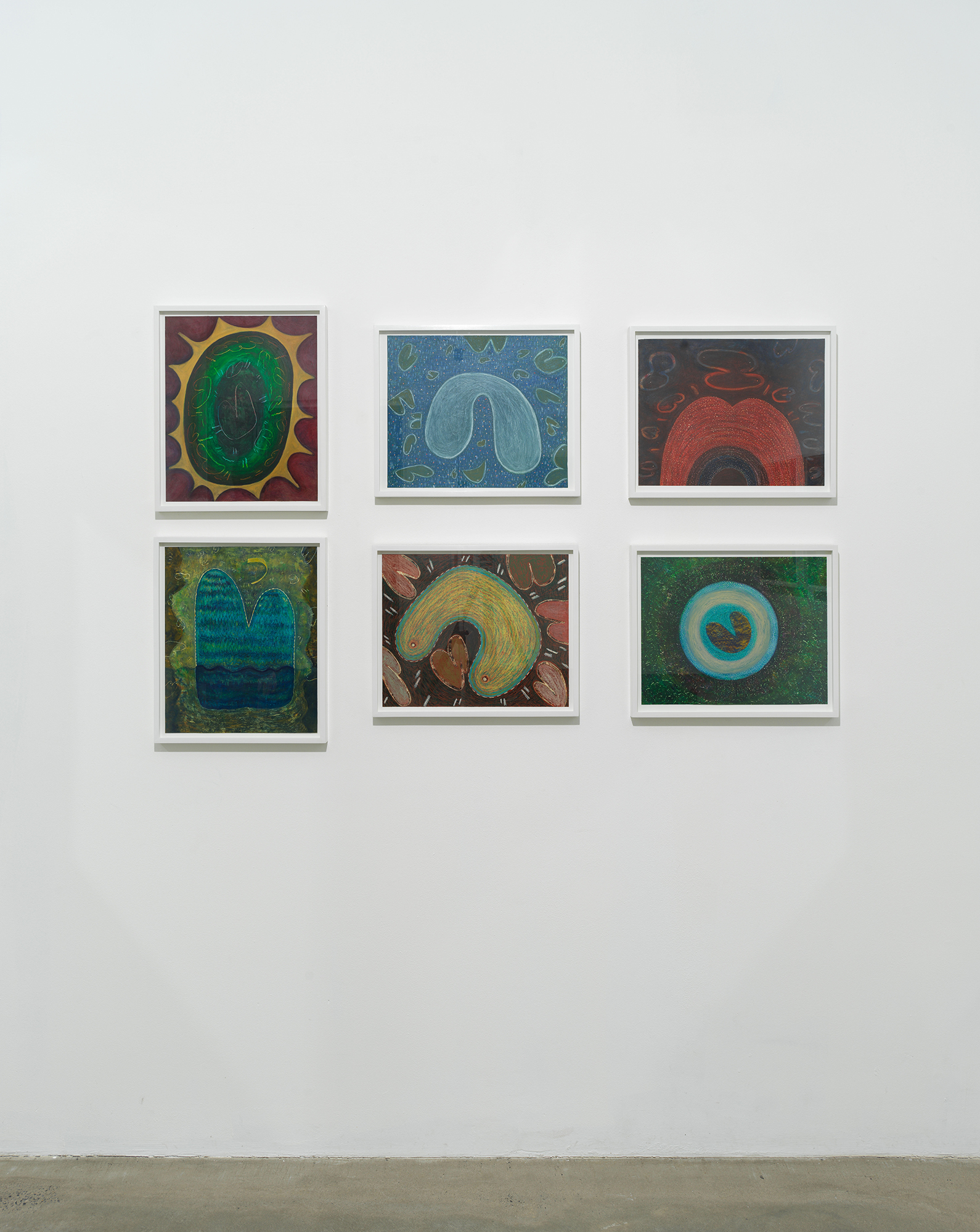 Installation view of works on paper by Ping Zheng showing grid of small works