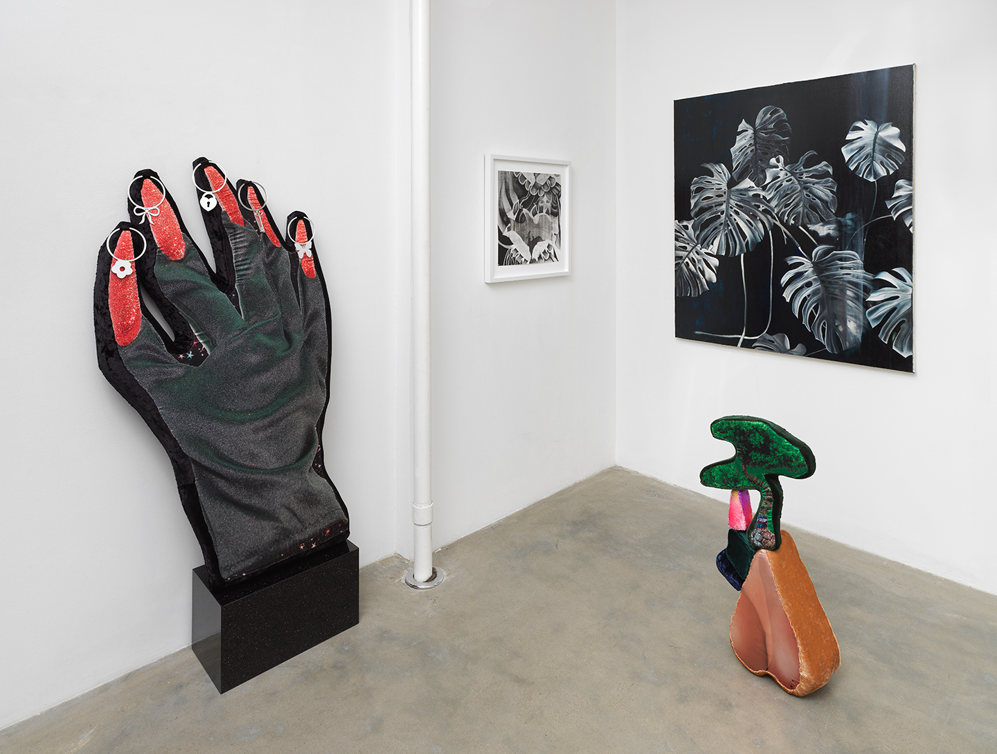 Installation view with digitally printed soft sculptures by Florencia Escudero and paintings and works on paper by Marcela Flórido