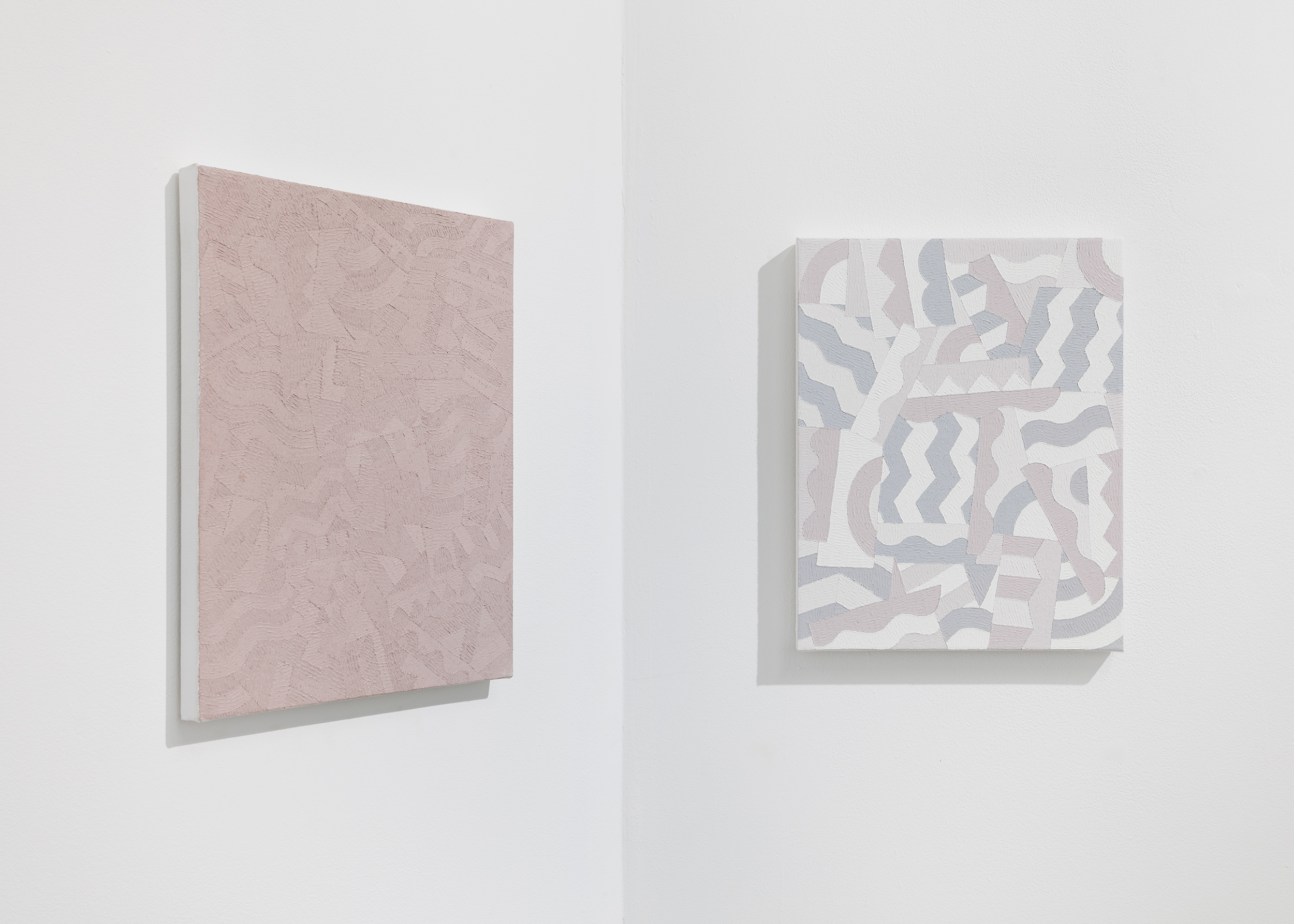 Installation view of Timothy Hull solo exhibition showing view of two small paintings