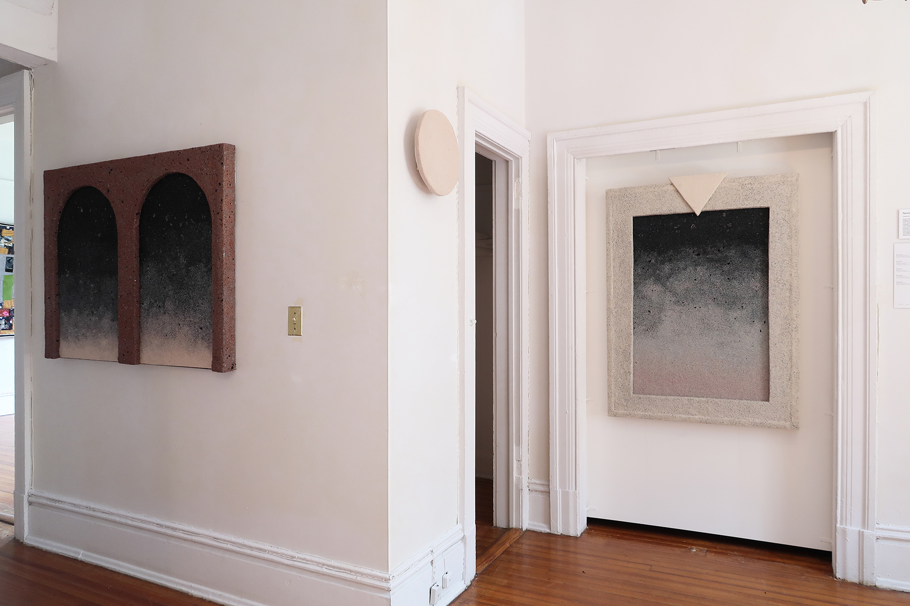 Installation view of Rachel Higgins's solo exhibition at NADA House showing rectangular and circular relief-based artworks