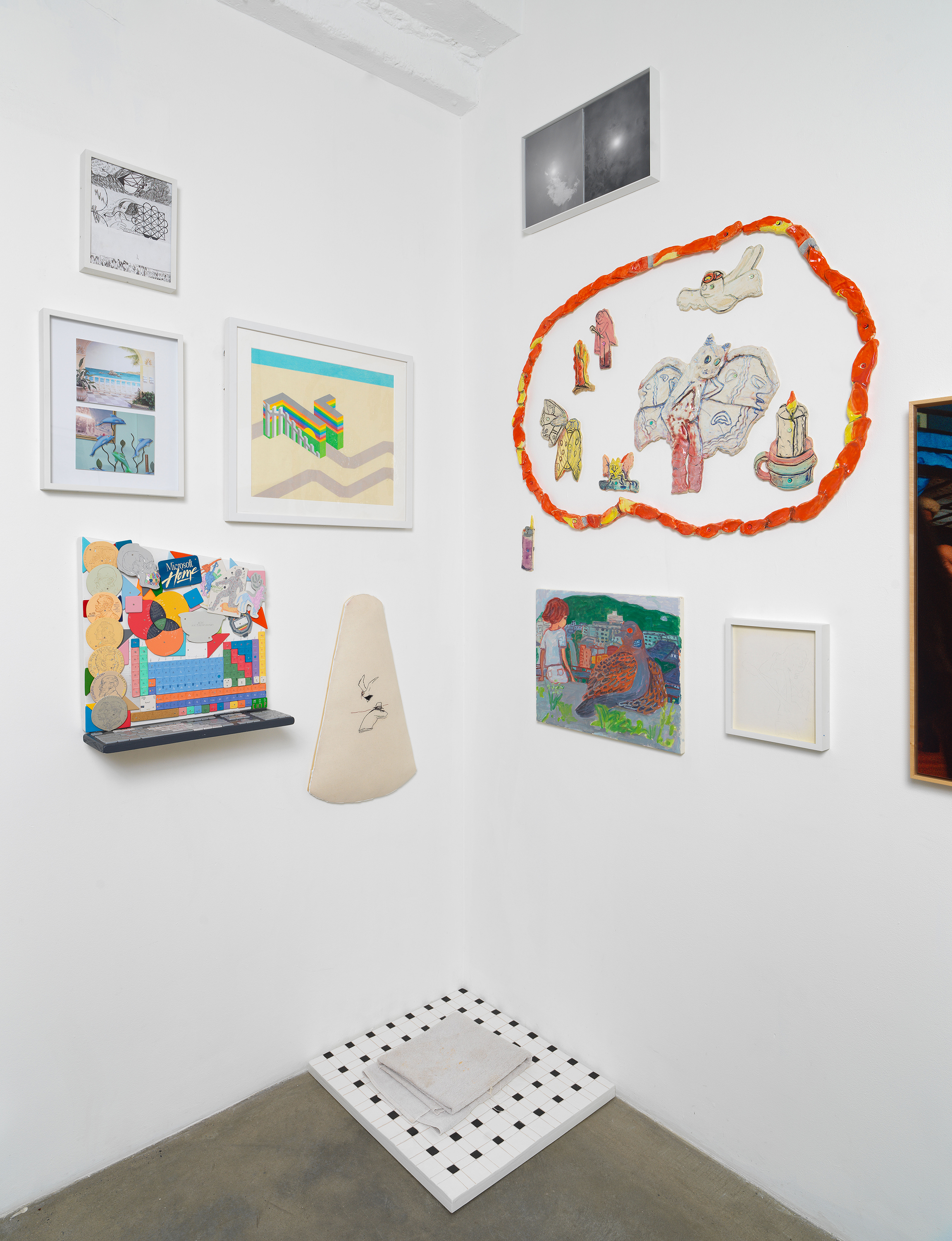 Installation view of 'Can You Dream It' featuring salon-style hanging of multimedia works by various artists and floor sculpture