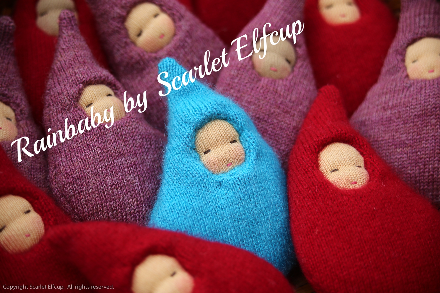  The Rainbaby was Scarlet Elfcup's very first creation. Read more about the inspiration behind this Scarlet Elfcup mascot  here . 