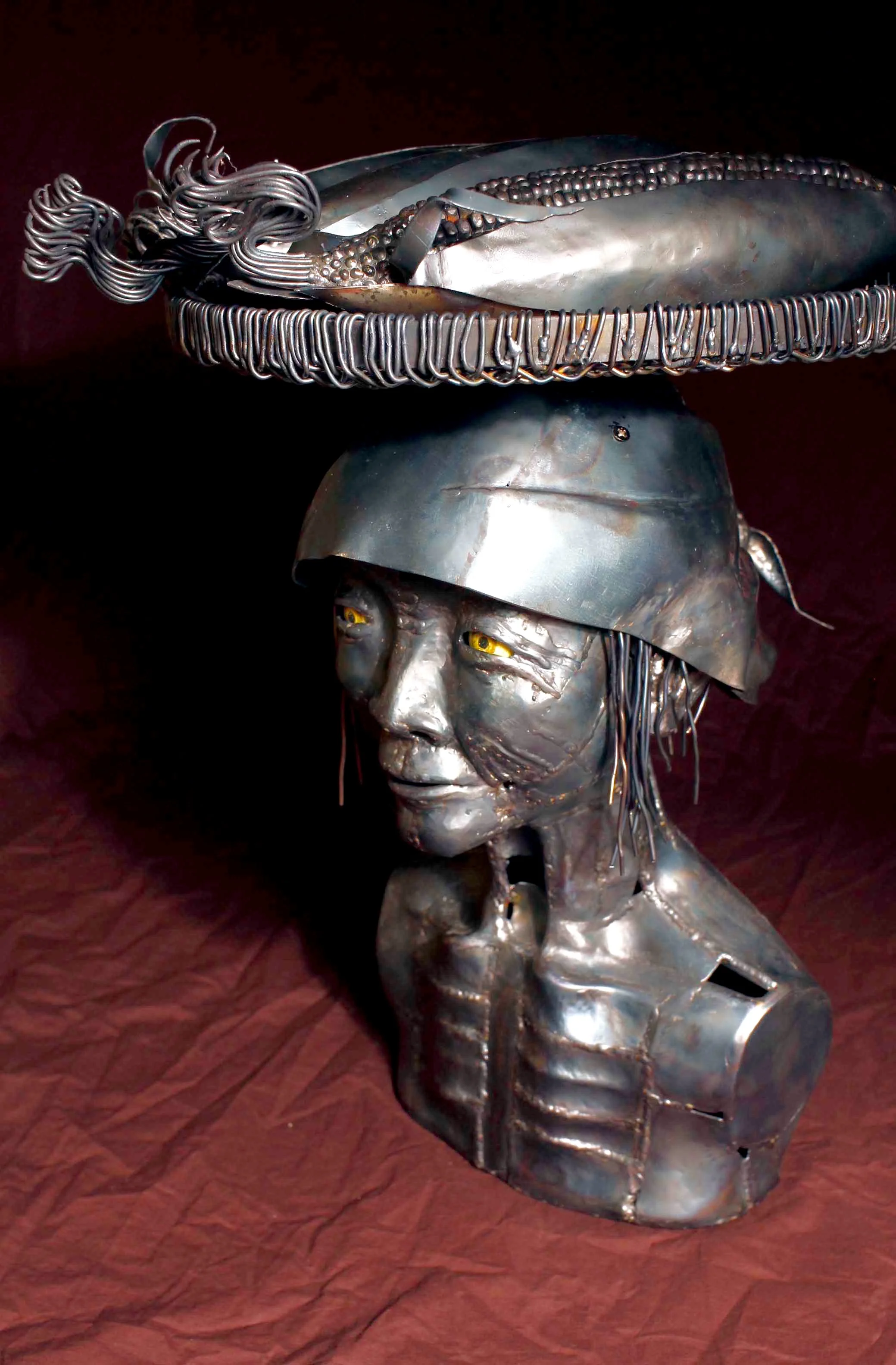 A Mother Who Sells Corn 12.99"x12.99"x19.29" steel, plastic (eye)