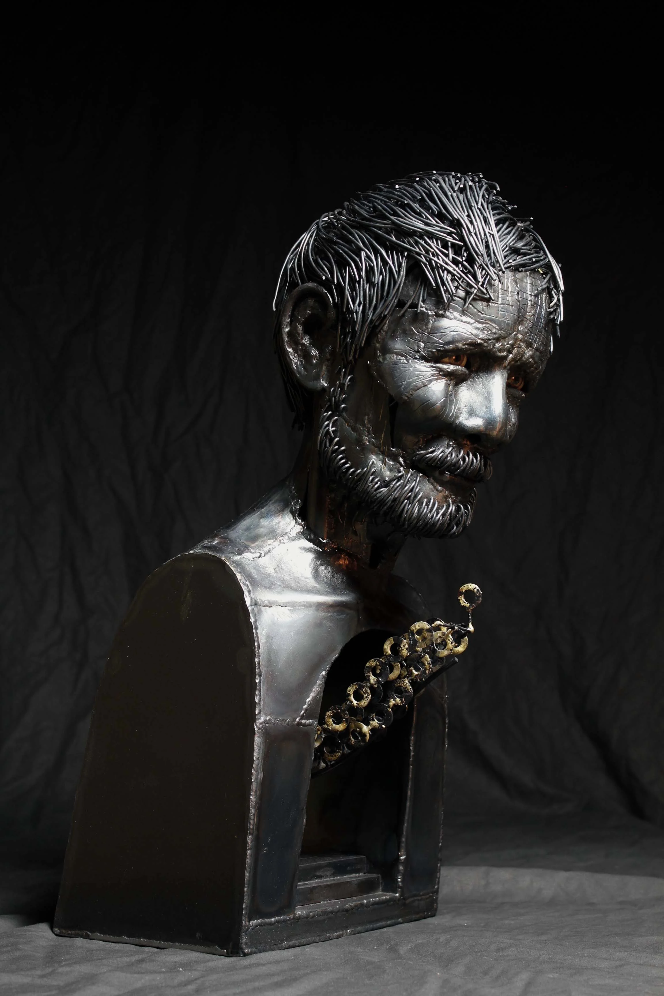 A Sculptor with Backbone 8"x13"x20 1/2" steel, plastic (eye), brass Artist Statement