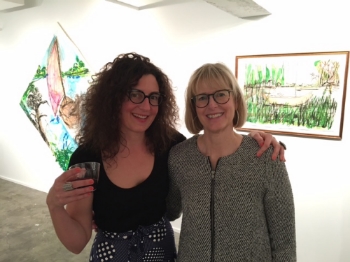 Laura Foster and Myra Clark take a little break at the opening of their shows "Disrupted" and "midden."