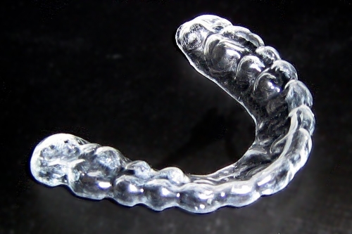 Custom made occlusal guard.