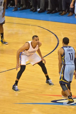 Thabo Sefolosha guards Memphis point guard Mike Conley in Game 5 of the Thunder-Grizzlies 1st Round playoff series. Photo By Torrey Purvey for InsideThunder.com