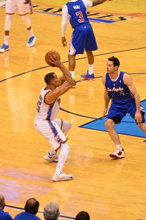 Thabo Sefolosha works against Clippers guard J.J. Redick. Photo by Torrey Purvey for InsideThunder.com