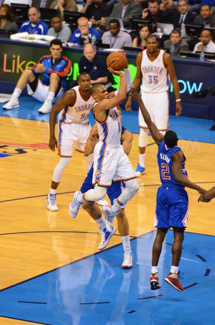 Russell flying through the air in Game 2 vs Clippers - Photo by Torrey Purvey for InsideThunder.com