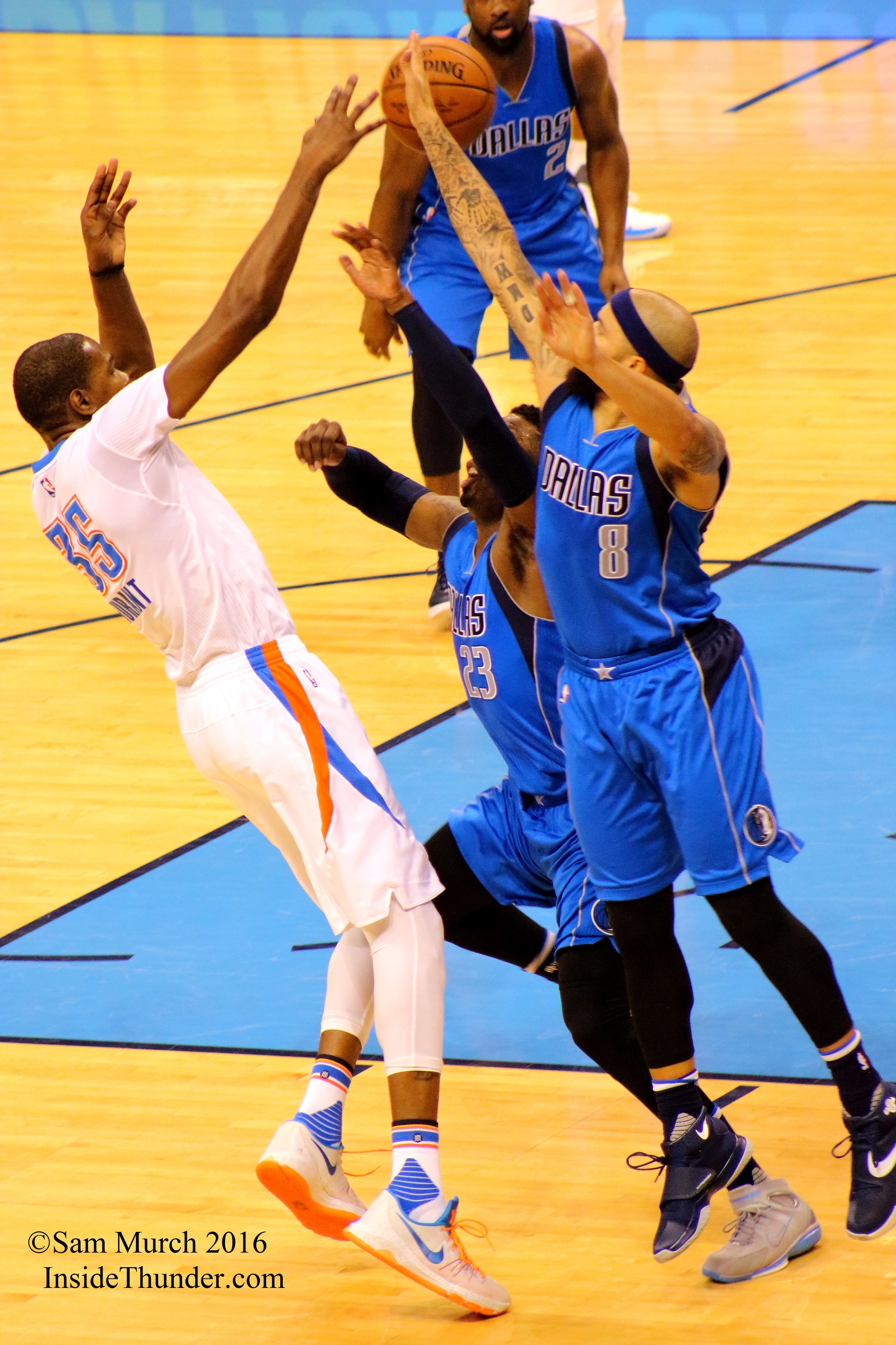 Kevin Durant has his shot partially blocked by Mavericks guard Deron Williams in Monday's 85-84 Dallas win. Photo by Sam Murch, InsideThunder.com