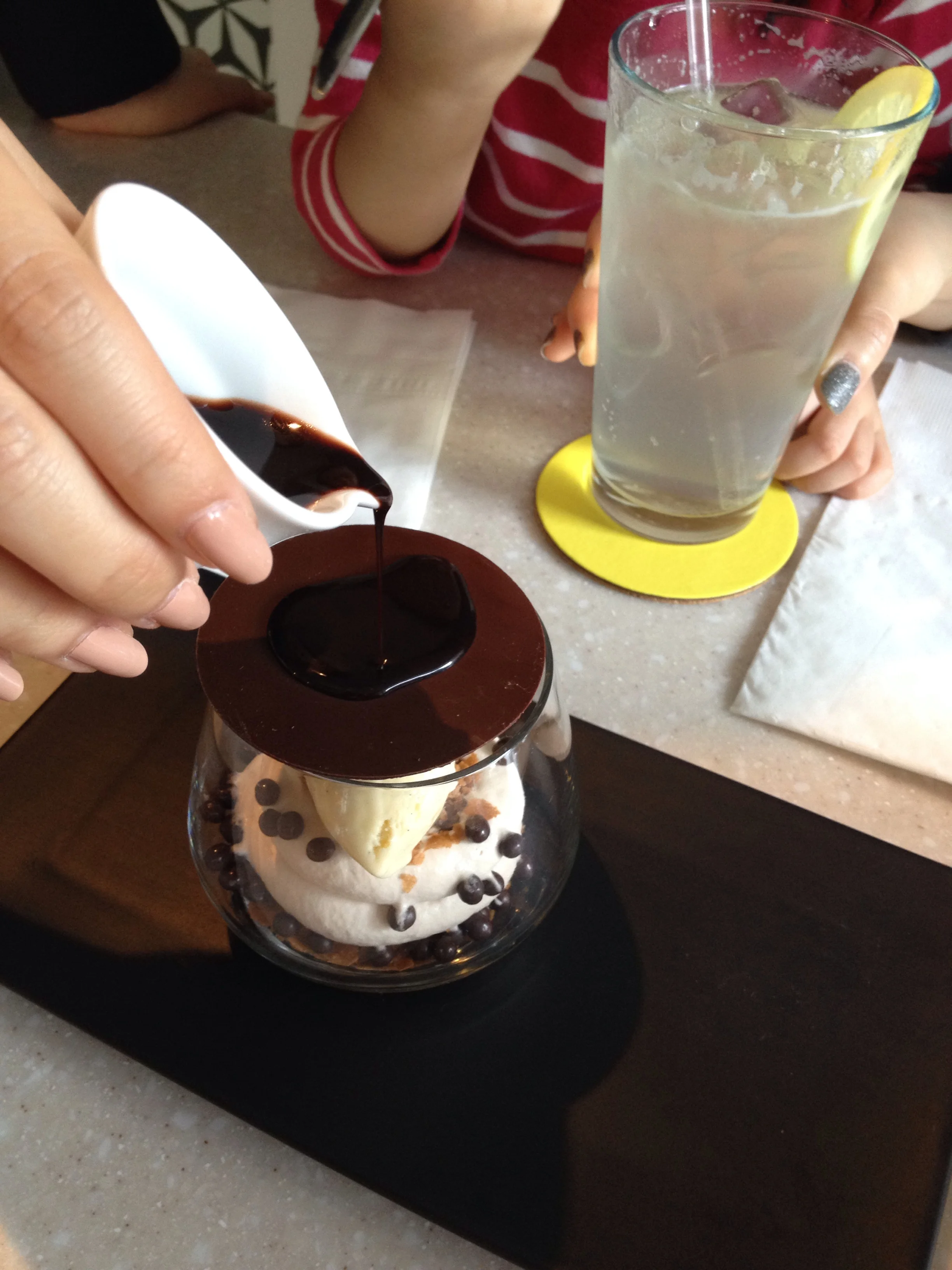 They pour warm dark chocolate over the thin layer of chocolate on top. 