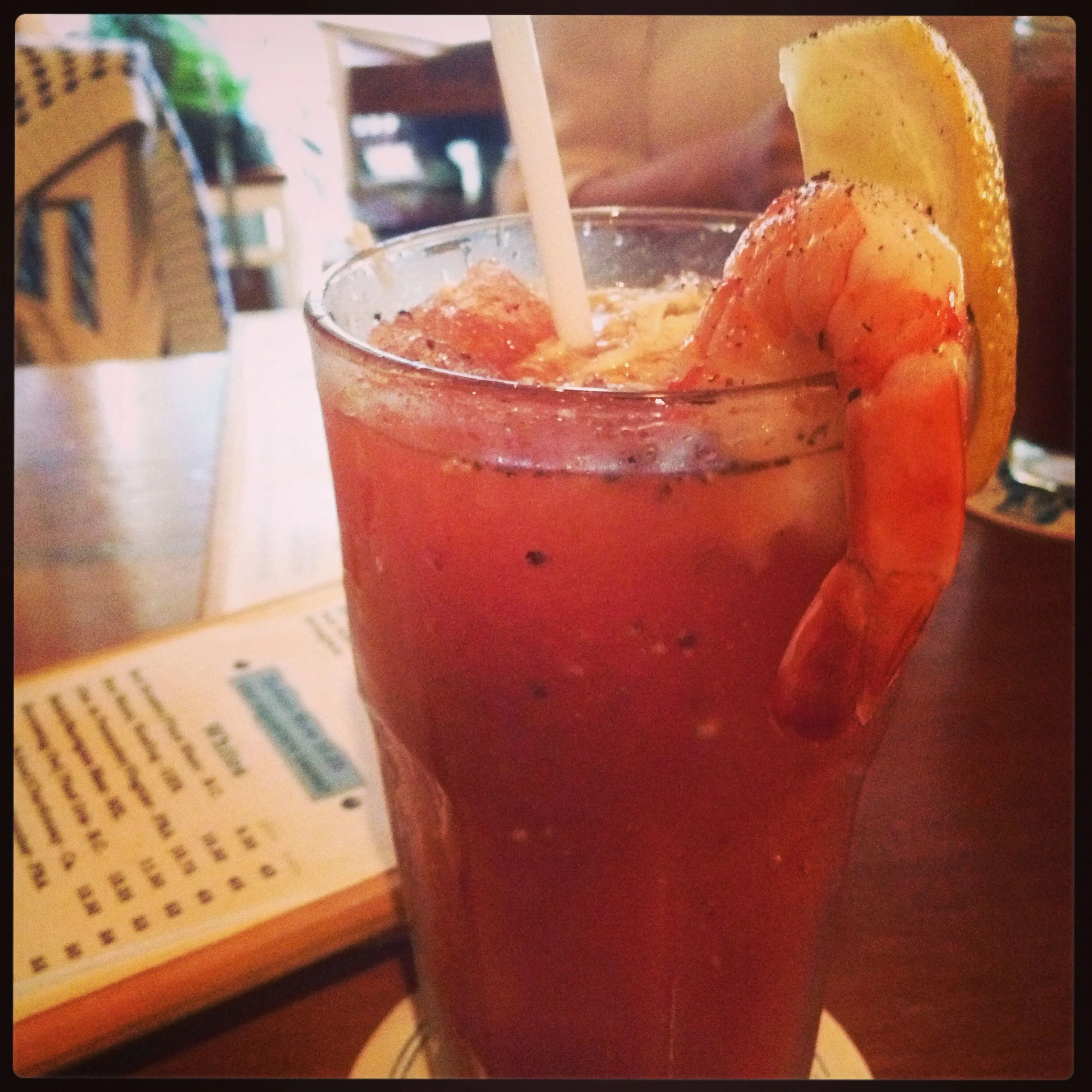 @Rodney's Oyster House, Gastown, Vancouver, BC, Canada. Both very similar, crushed ice in a caesar with lemon, fresh horseradish and a prawn for garnish. 