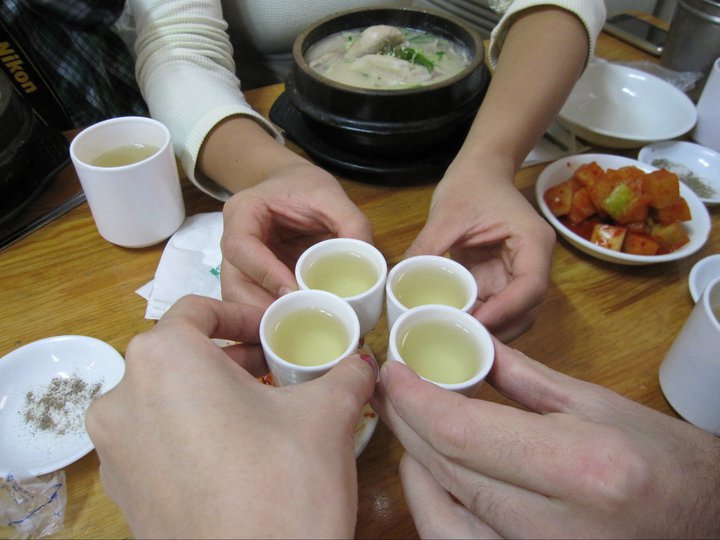 Cheers! They give you a cup of ginseng alcohol here to start. You can either drink it like a shot, or put it inside your soup if you want. 