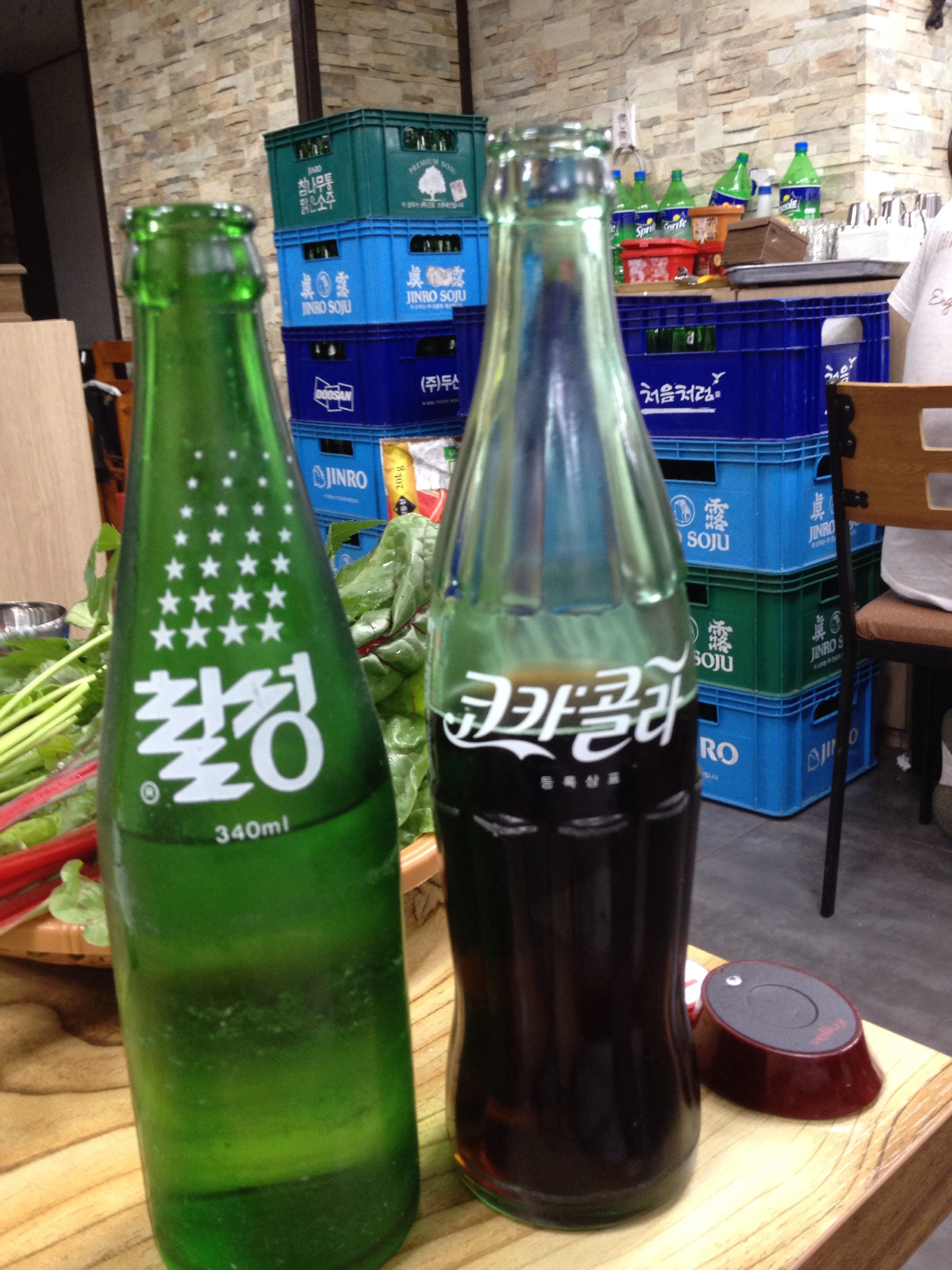 Cute old school glass pop bottles. Chilseng Cider and Coca-Cola. 