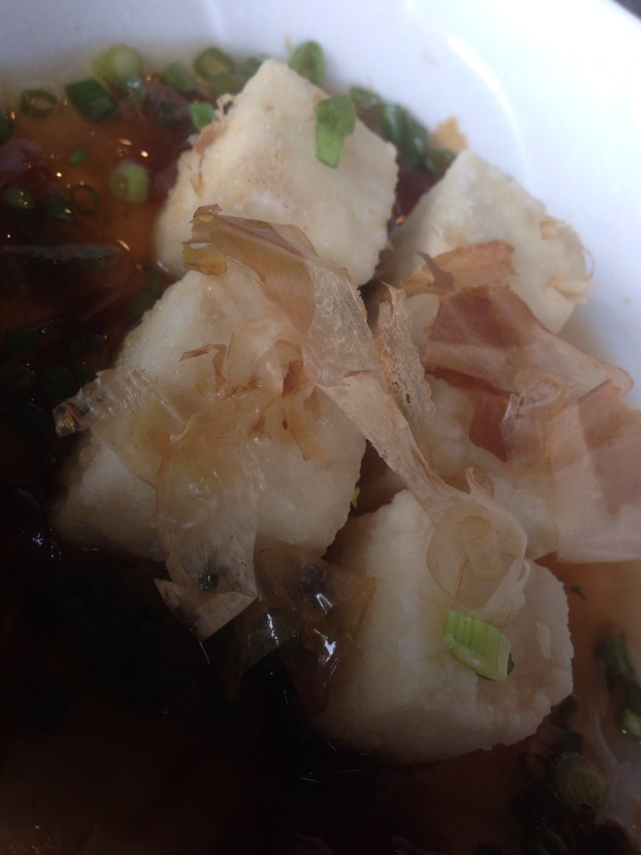 Agadashi Tofu as a starter - mini cubes of deep fried tofu in a sweet light soy sauce, topped with bonito flakes.