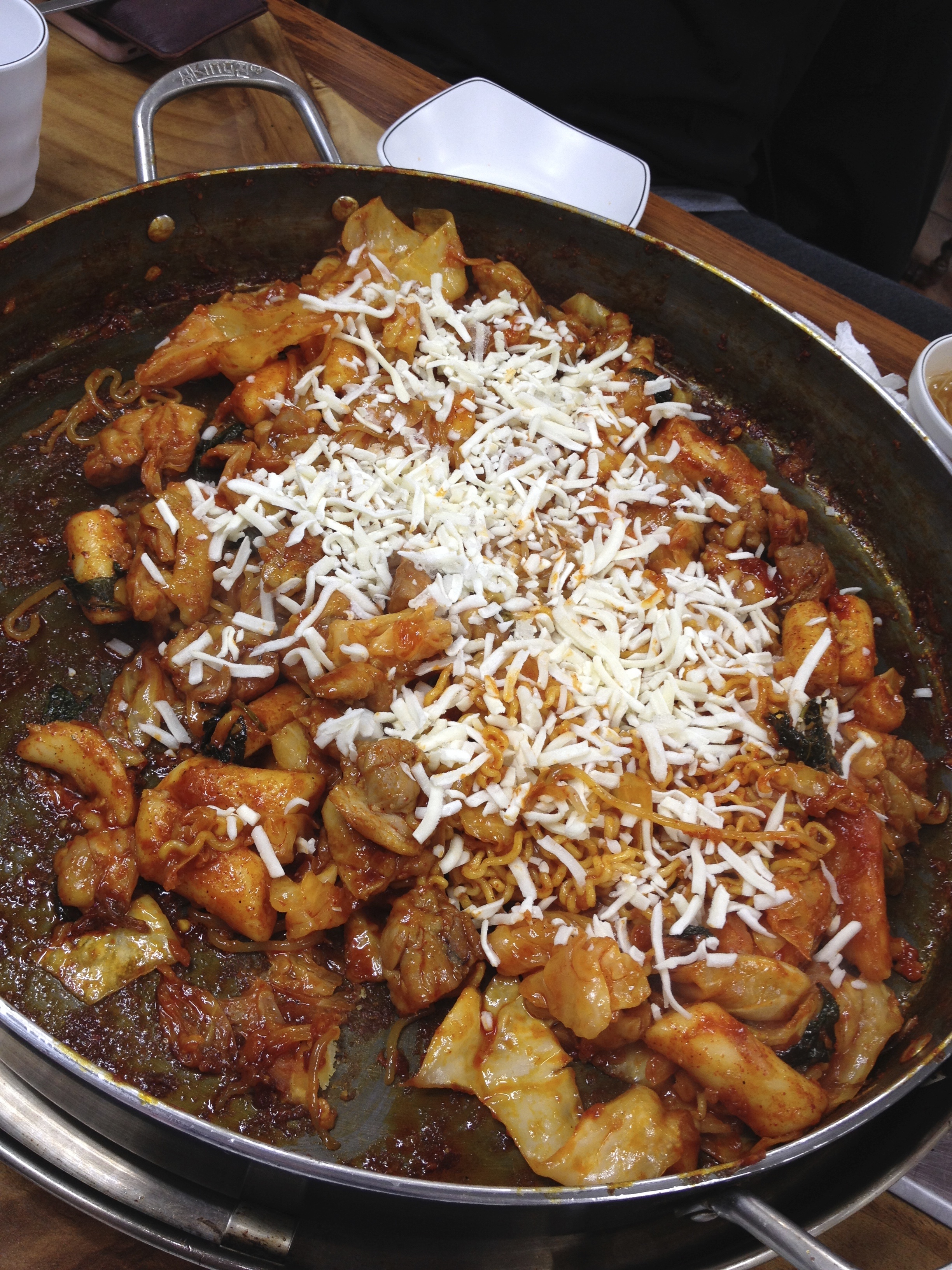 Here, you have the option of adding on mozzarella cheese as well. They sprinkle it on, leave the lid on for 3 minutes to let the cheese melt all over. 
