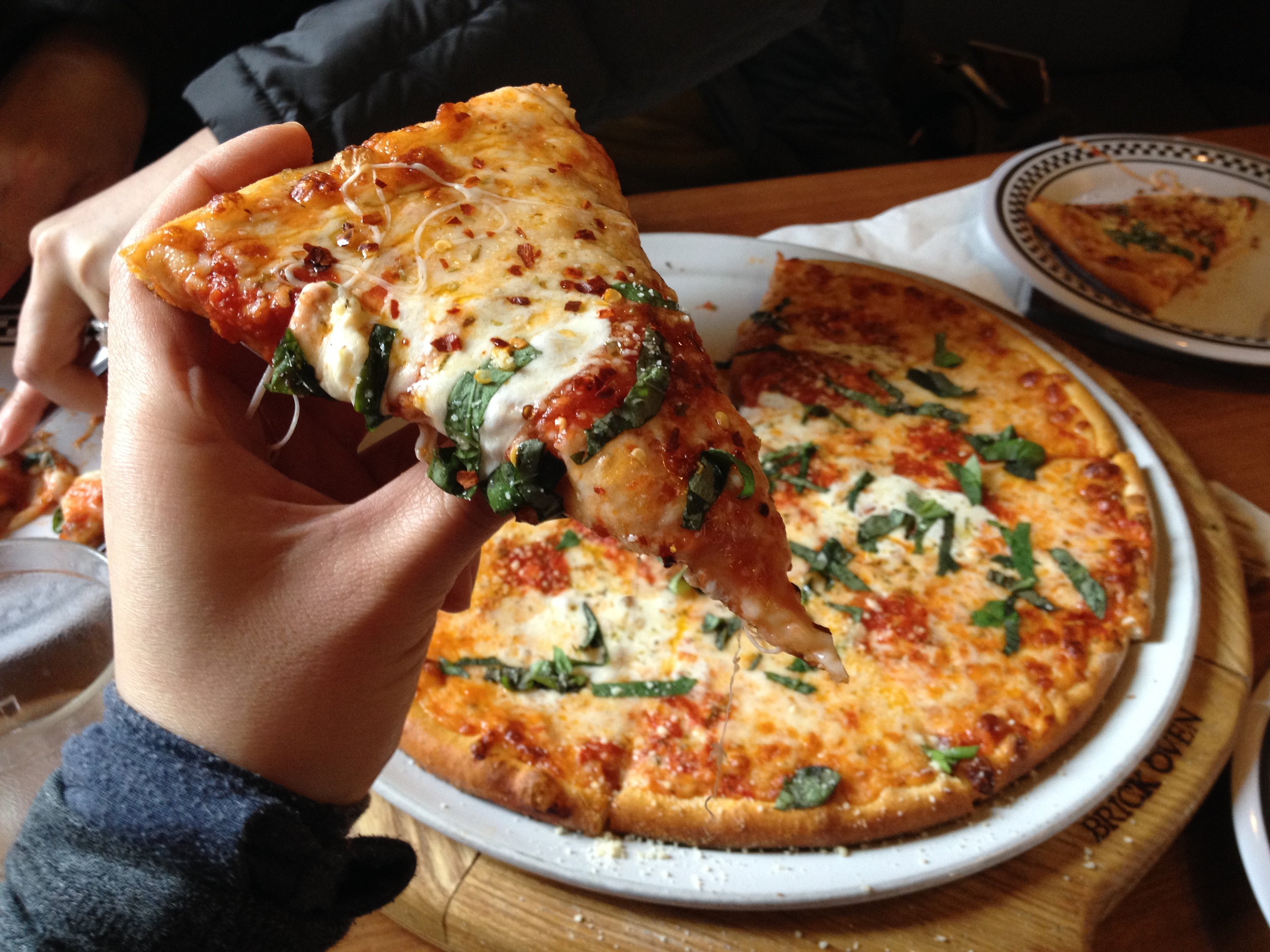 American style pizza - the crust is firm enough to hold in your hand, but soft enough to fold if you want. I think the slices here are a bit small to fold, but it holds nicely. I don't know why people are always comparing between places like here and Italian style pizza like AL MATTO. It's just a different style of pizza altogether! I like both, they are just different! Italian style pizza is thin too, but has a more chewy/softer crust which is why they serve it whole in Europe with a fork and knife and put on chilli oil. American pizza, the crust is a bit more firm, and you eat it with your hands and put on dry chilli flakes!