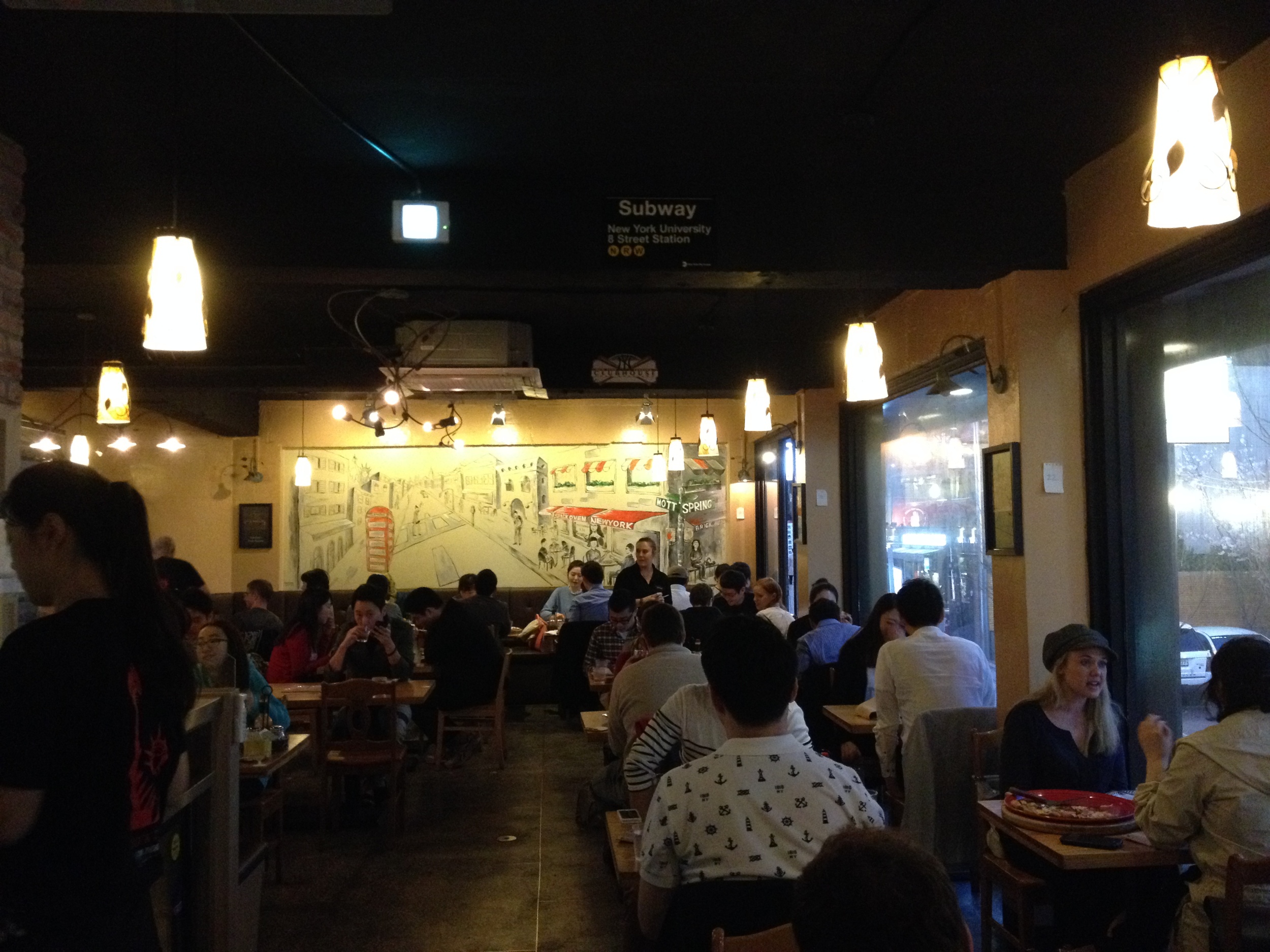 The inside is decorated with a simple style. Lots of pictures and articles of pizza places and scenes of NYC. It's a casual atmosphere and you go for the food!