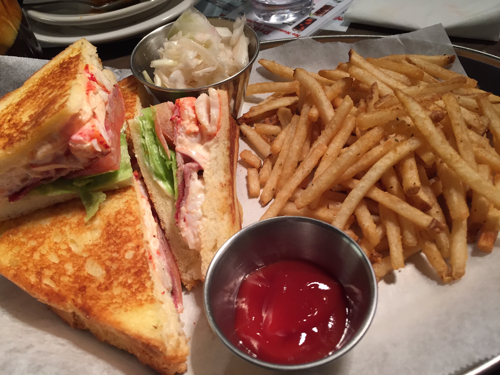 New Item: Lobster BLT Sandwich - " Traditional BLT with lobster." If you like BLT sandwiches and lobster - you will love this! No surprises here - smokey bacon, crisp iceberg lettuce and fresh cut tomatoes all in a nice buttery toasted bread. Comes with a side of their signature coleslaw and skinny fries - and KETCHUP. Yes!