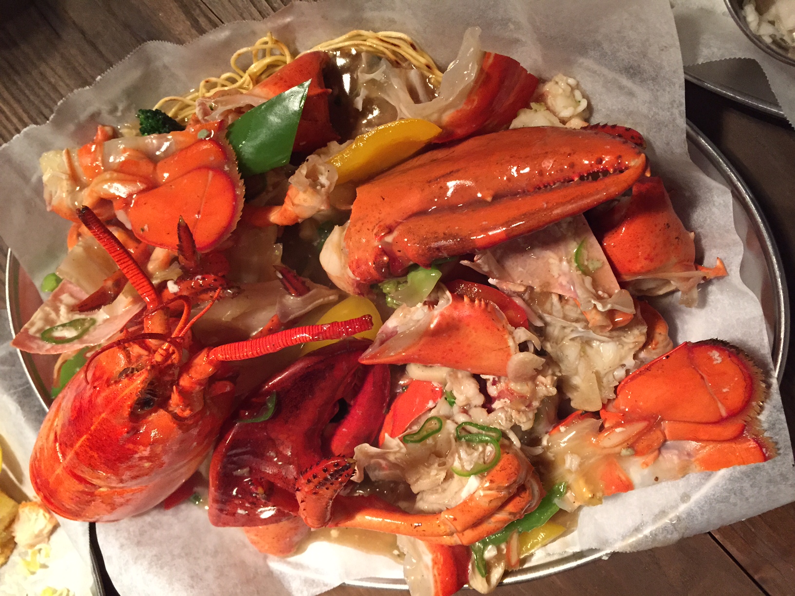 New Item: Cantonese Style Lobster - "1) Cantonese Lobster - "Cantonese style with garlic, spr ing onions, and spicy peppers." An awesome new dish - lobster that was cut up into pieces and tossed in a savoury garlicky sauce with a touch of heat (spice) from the peppers. It wasn't overly spiced, but had a nice tingle to offset what could've been a bit too greasy/heavy. The bed of crispy chow-mein noodles was a surprise, but it was a perfect combo for this sauce and dish! I loved how the noodles were slightly charred on the edges with some dry pieces of noodle not yet mixed into the sauce. Actually, I've also tried another kind of Cantonese style crab which I've only ever eaten/seen when I was living in Hong Kong - it was crab on top of toasted rice (like noorengee), but smothered, and I mean smothered in a melted fake cheese type of oozing cheese. Apparently it's very Cantonese, so I enjoyed trying it in HK, but I can't say that I ate it very often. I much prefer the black bean or garlic ginger sauce kind like this. 
