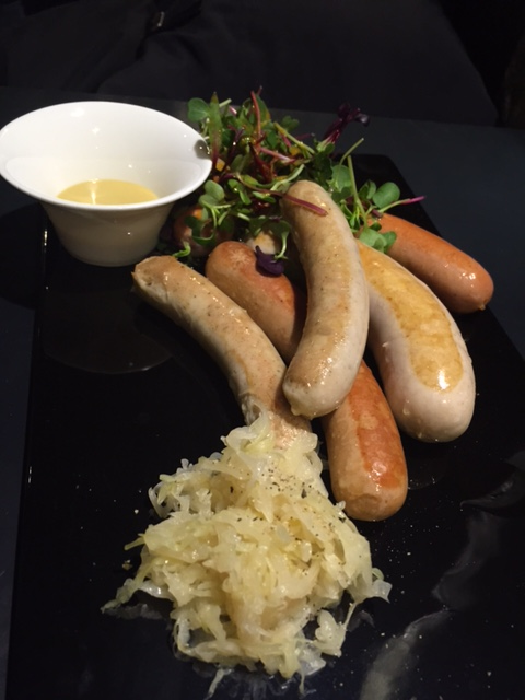 4 Sausage Platter - Grilled Chef Meili Krainer, Salzburg, Nuremberg and Italian Fennel Seed Sausage with Sauerkraut and mixed salad.