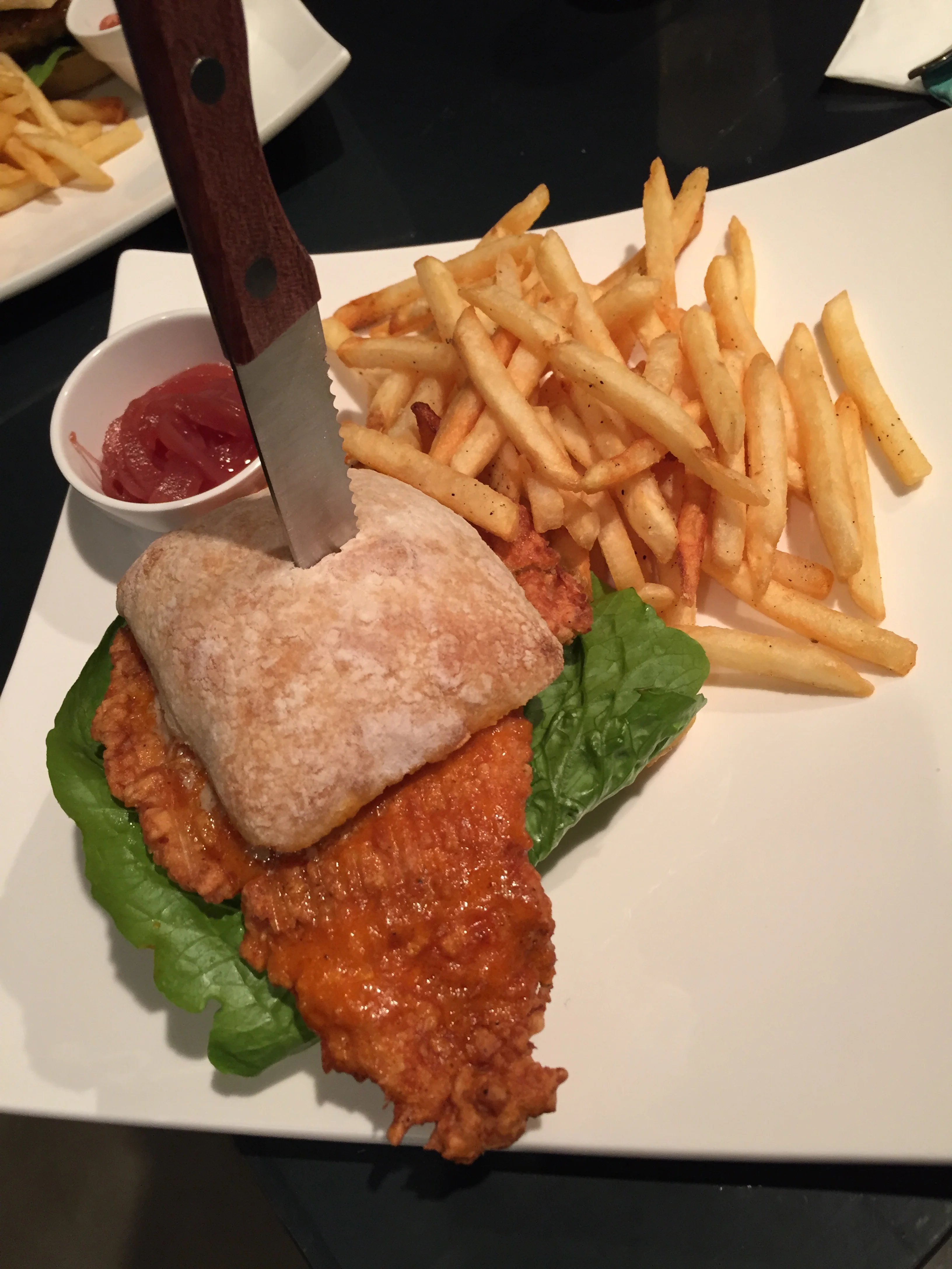 BUFFALO CHICKEN (13 000won) - "Battered chicken breast tossed in Buffalo Sauce on a Ciabatta Bun with blue cheese vinaigrette, lettuce and tomato. If you like Buffalo chicken wings, you will love this chicken burger. Generous piece of chicken meat and the sauce tastes just like a deliciously spicy buffalo chicken wing! Went great with the Ciabatta bread to soak up the sauce. There wasn't anything special about these fries, but make sure to order the SIDEWINDERS!