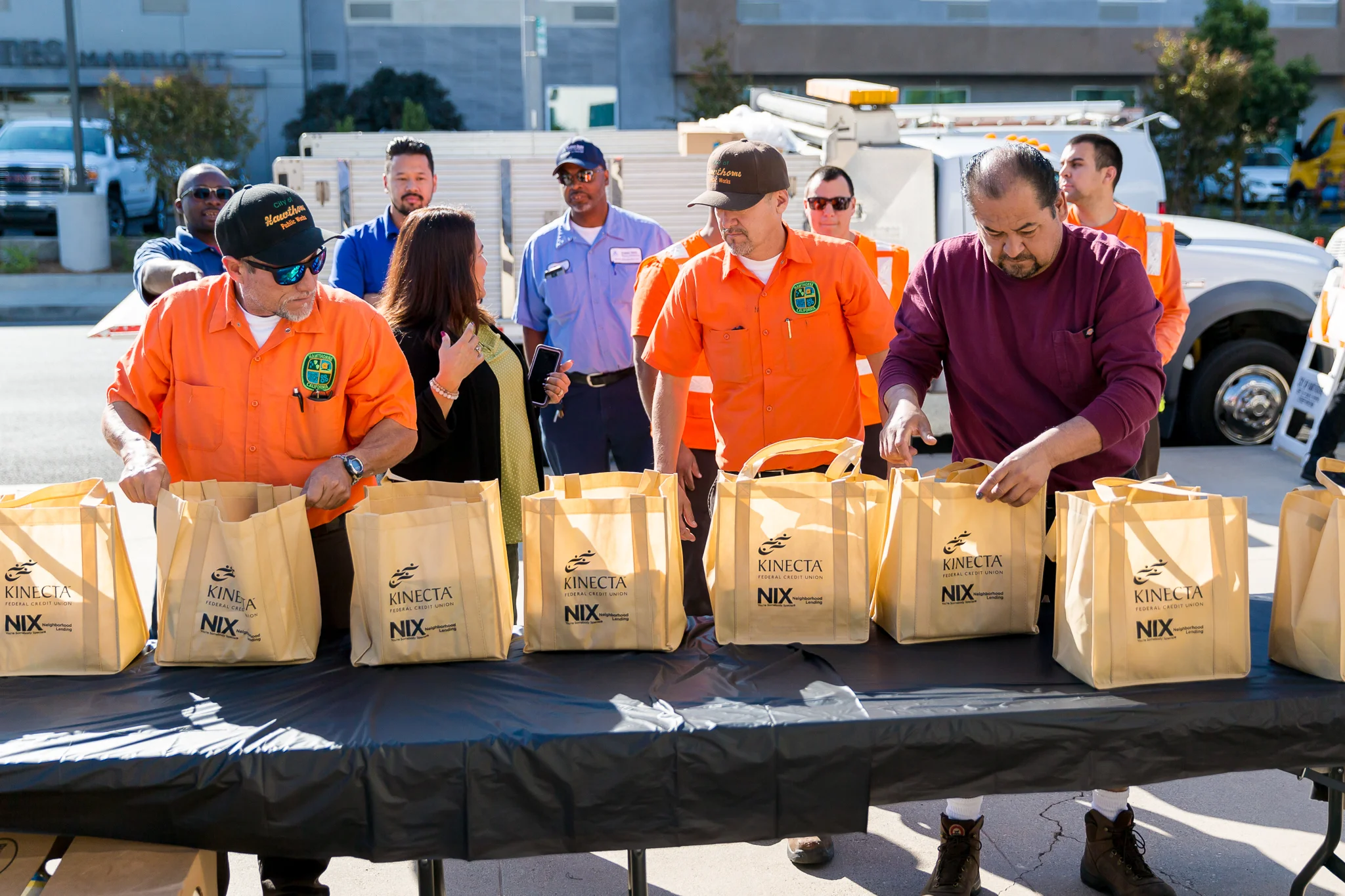 Public Works staff assembling bags for distribution