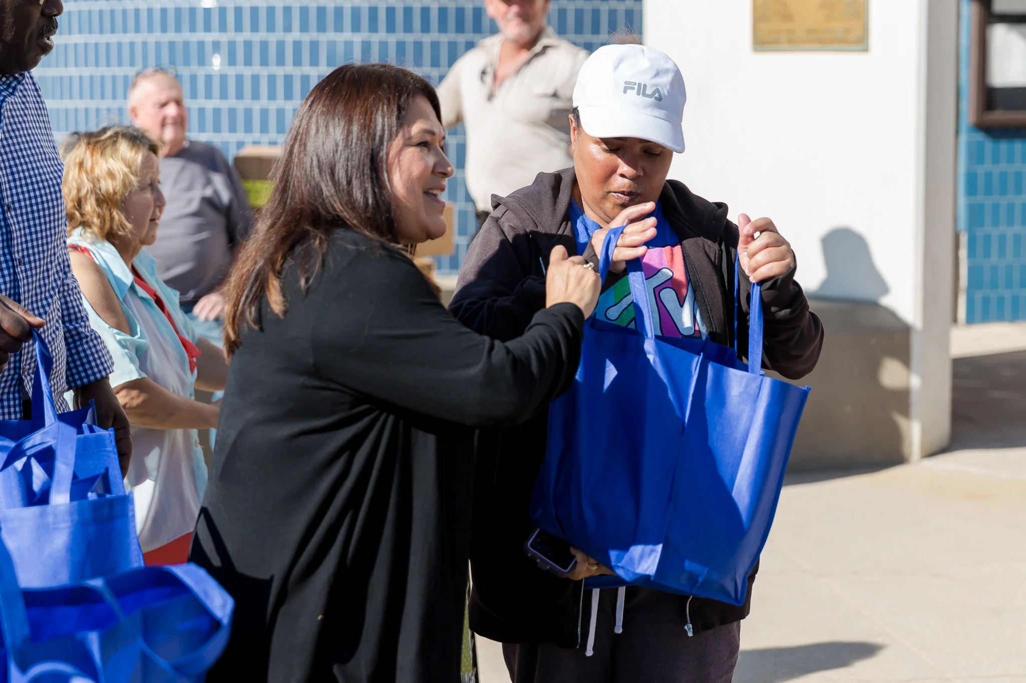 Council Member Angie English distributing turkey
