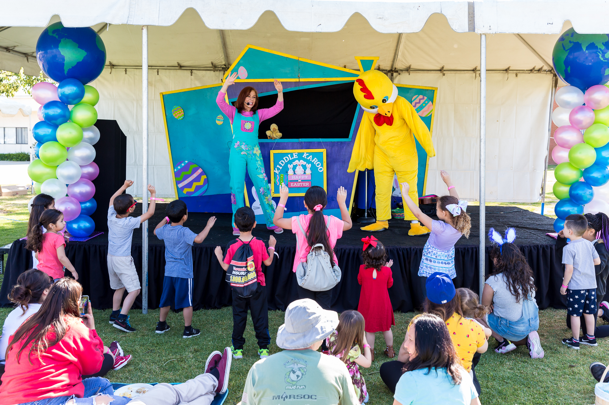 Yellow chick dancing on stage